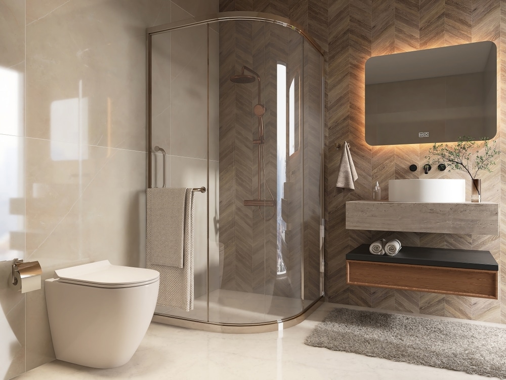 Salle de Bain Moderne avec Douche et Carrelage Chevron Salle de bain moderne avec douche vitrée, carrelage en chevron bois, lavabo vasque et WC suspendu blanc.